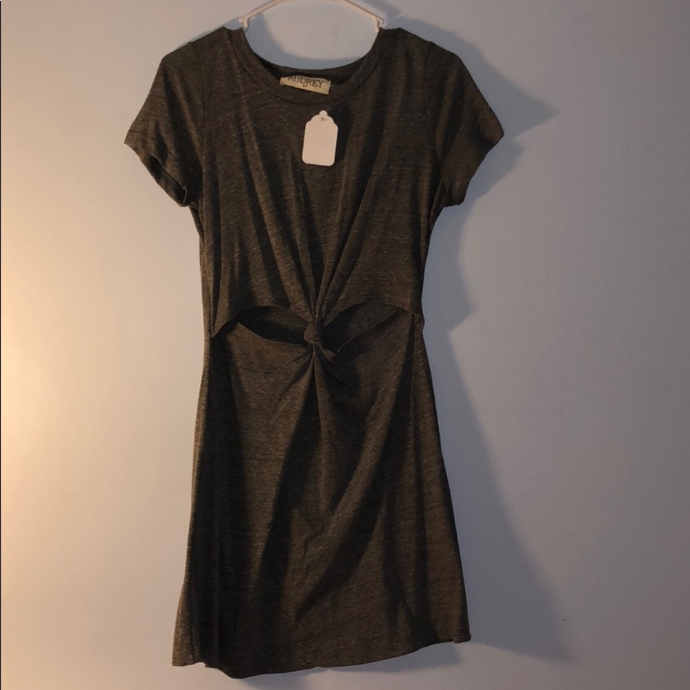 Flowy unworn dress with a hole knot tie in front